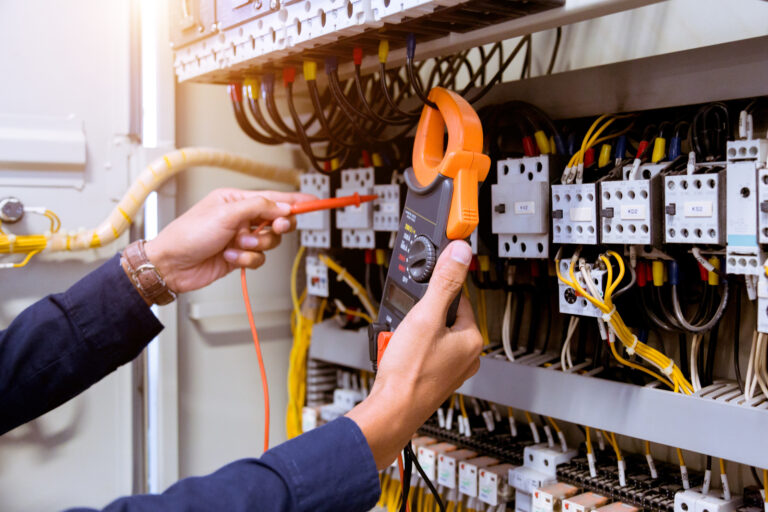 electrician testing an electrical panel