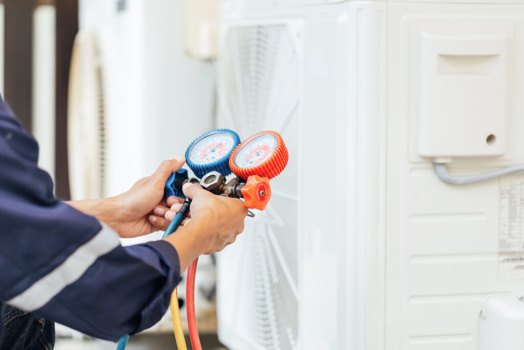 Air Conditioning Technician and A part of preparing to install new air conditioner after HVAC digital marketing filled their calendar.