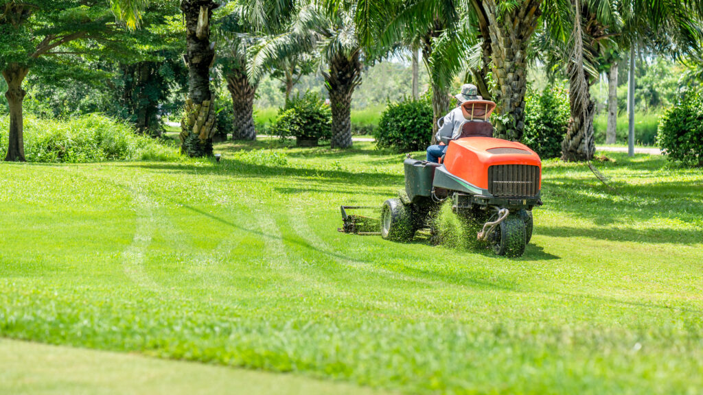 Workers use mower working on the golf course after Tampa landscaping PPC services filled their schedule