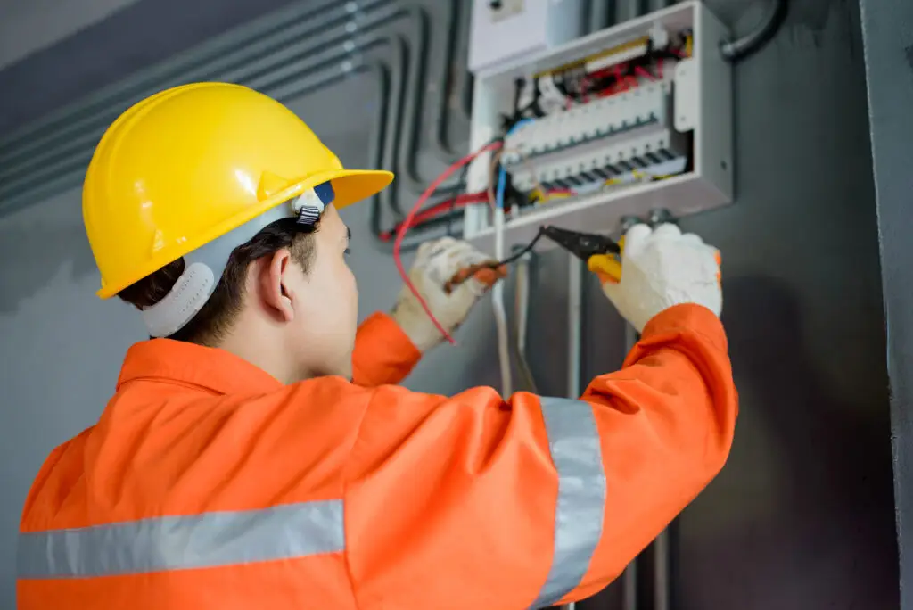Asian male electricians inspect and install electrical systems in houses and buildings after home services SEO filled their calendar with work.