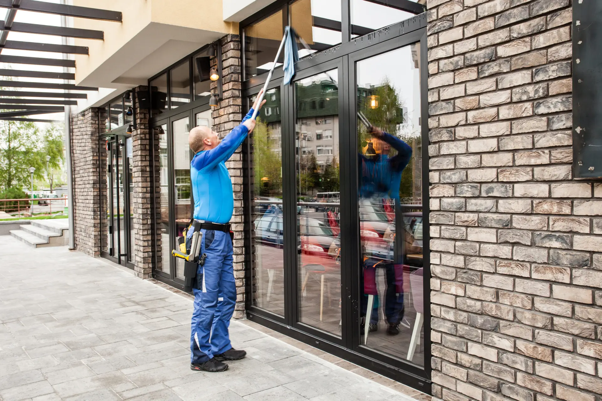 Window cleaning technician working on a Tampa Bay home exterior — the type of high-margin recurring job that window cleaning SEO in Tampa FL is built to generate consistently