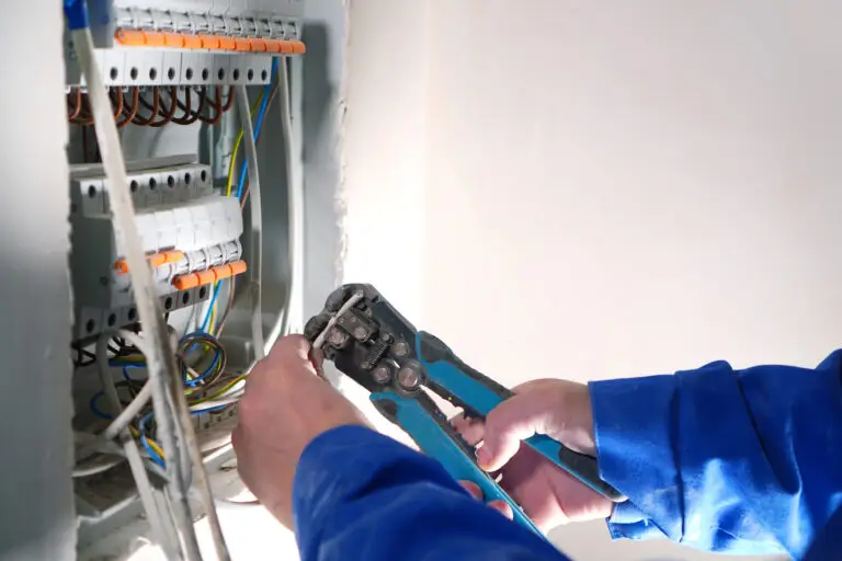 Tampa electrician working on an electrical panel after a new conversion-focused website earned them the job