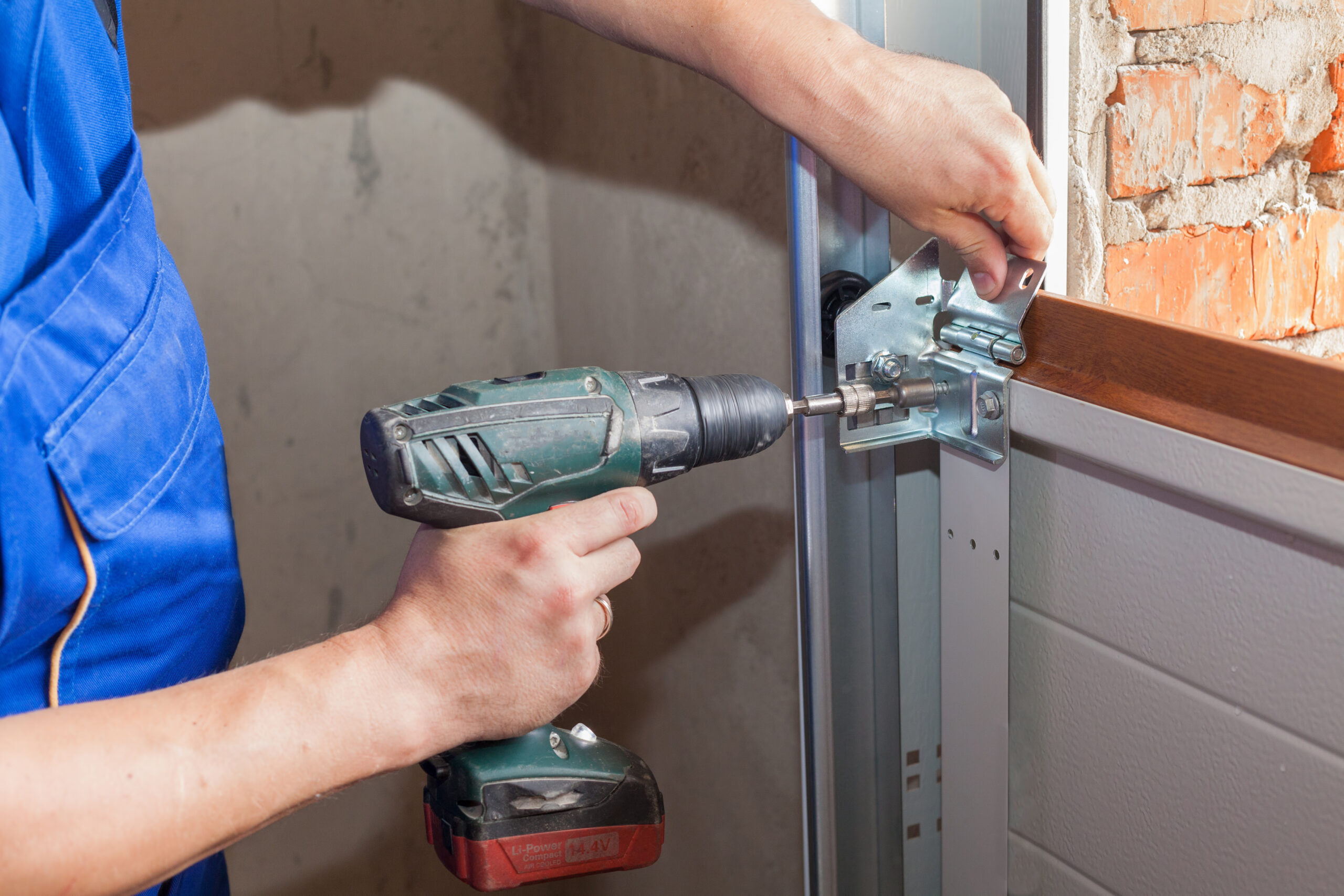 Tampa Bay garage door repair technician servicing a residential garage door — the high-intent emergency job that garage door repair SEO company strategies in Tampa FL are built to capture first